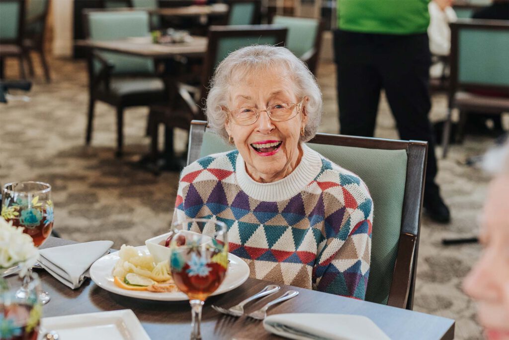 Senior woman seated at dining table