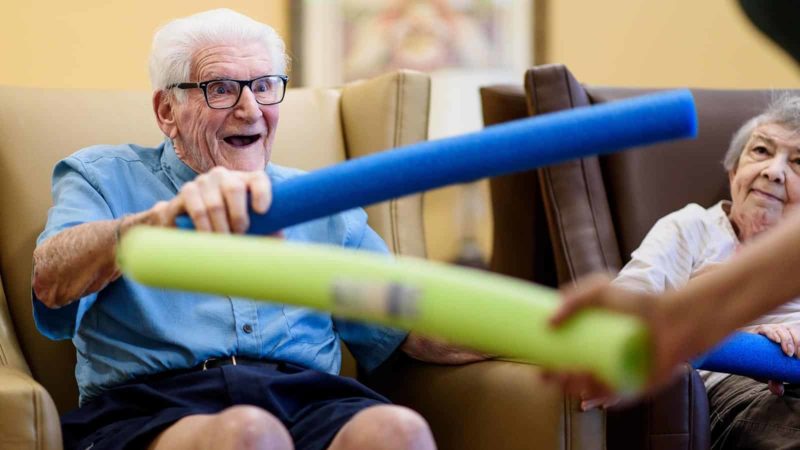 Senior man holding a foam noodle